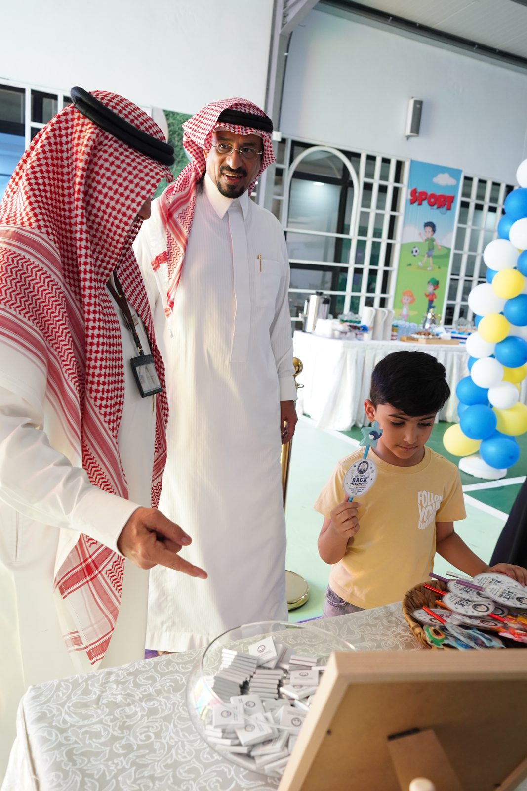Student choosing a gift at the welcome table